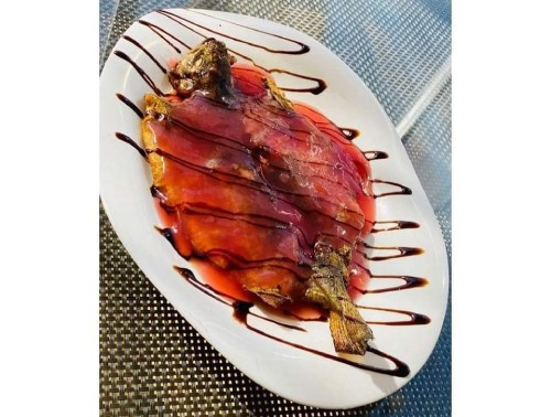 კალმახი შემწვარი ბროწეულის სოუსით